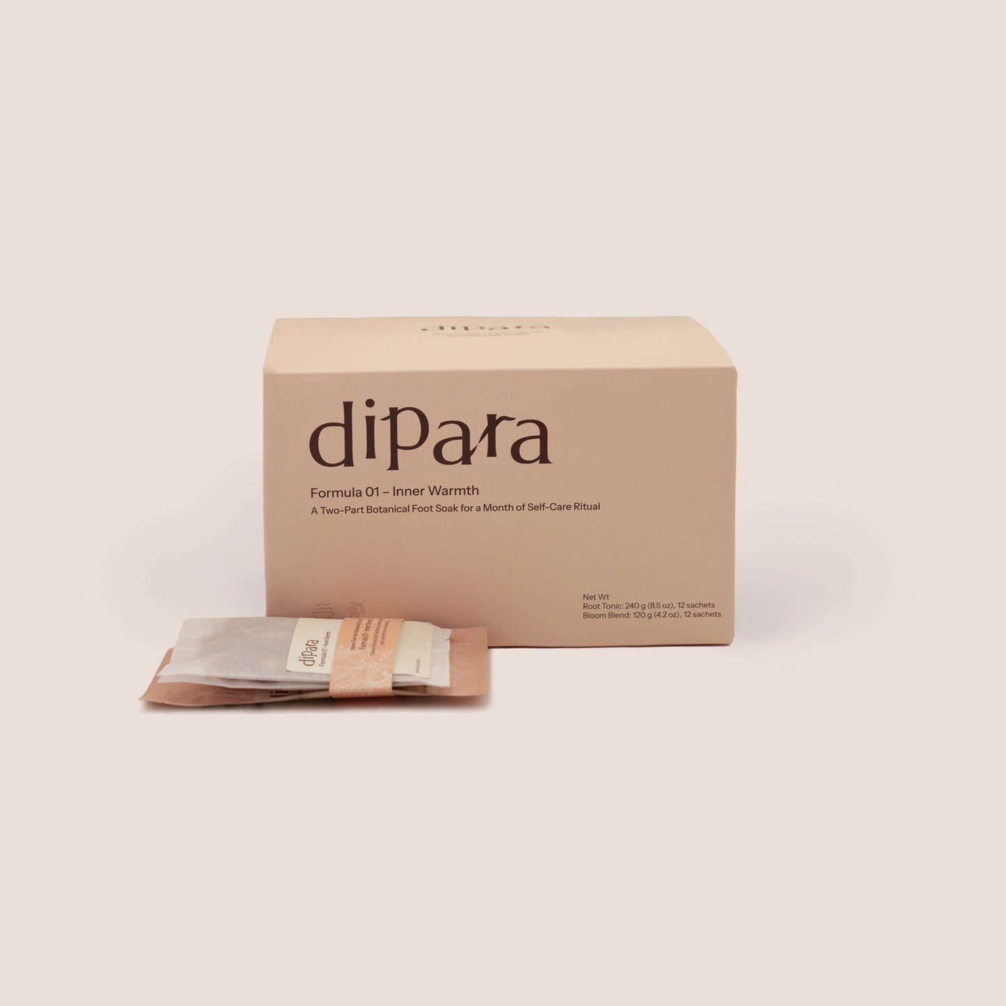 Dipara Formula 01 Inner Warmth herbal foot soak box set with individual botanical sachets, presented in a minimalist studio setting.
